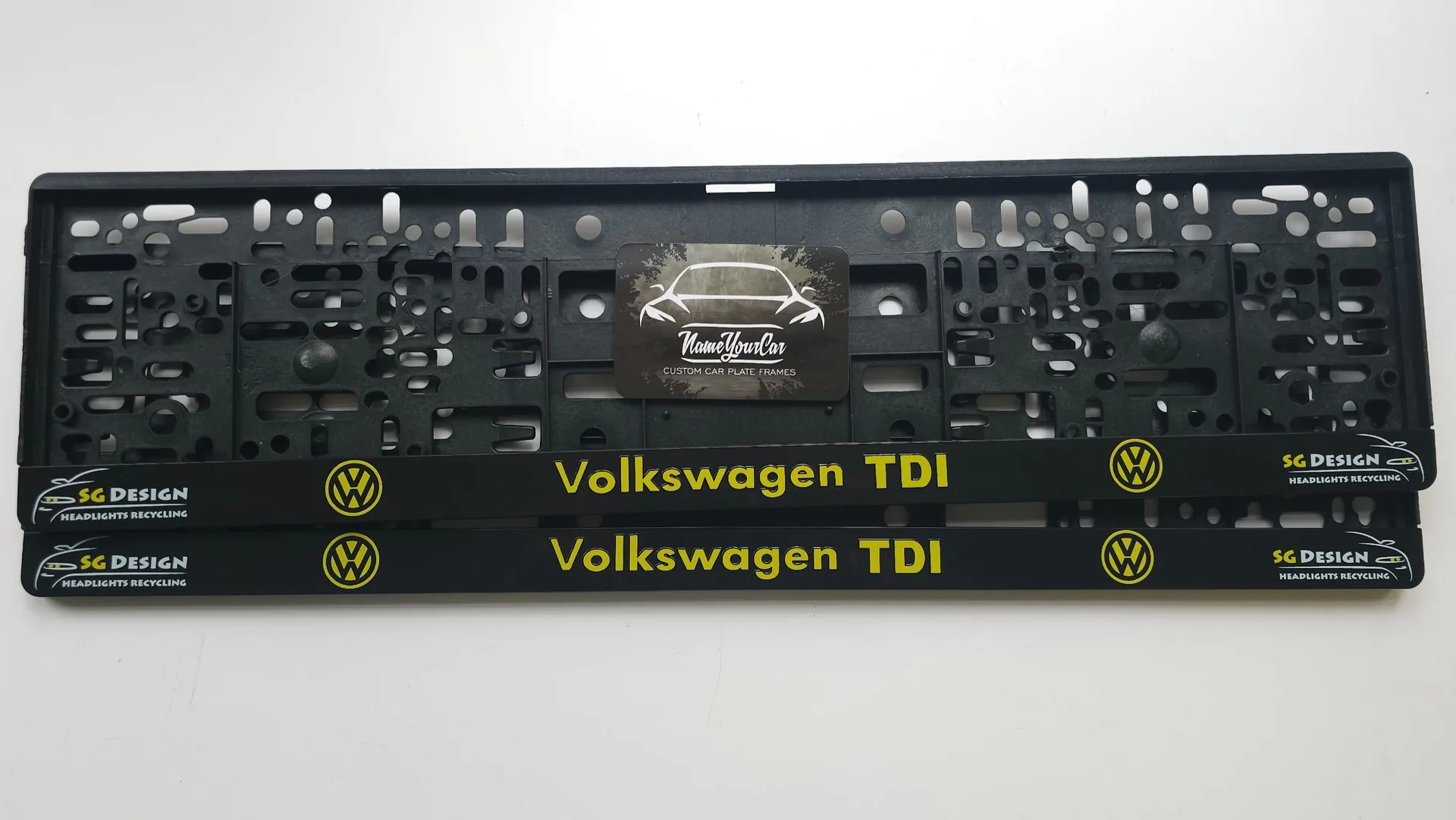 Volkswagen TDI license plate frame with company logo in yellow and UV print from nameyourcar.store