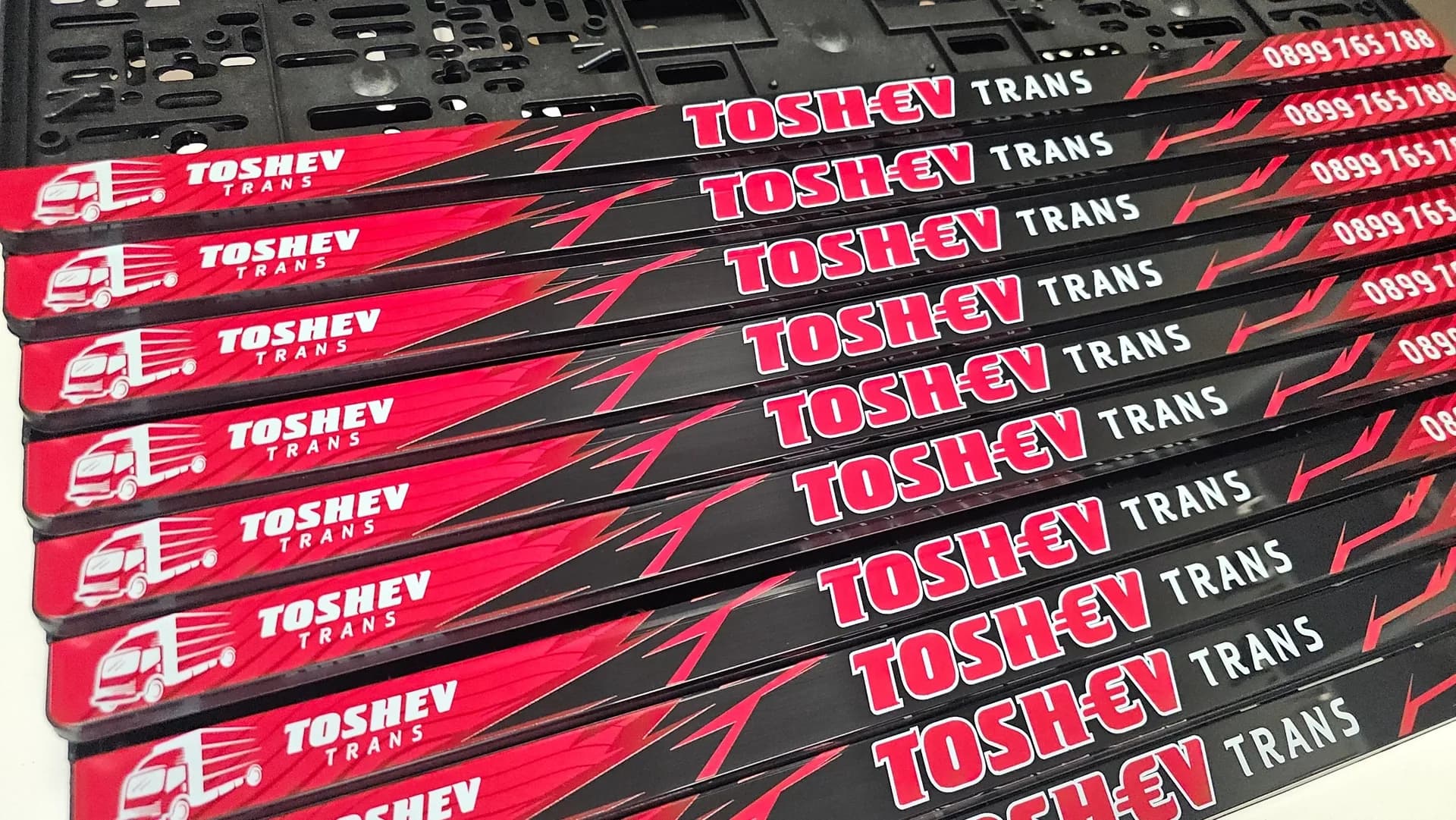 Toshev Trans advertising company license plate frames with UV print from nameyourcar.store