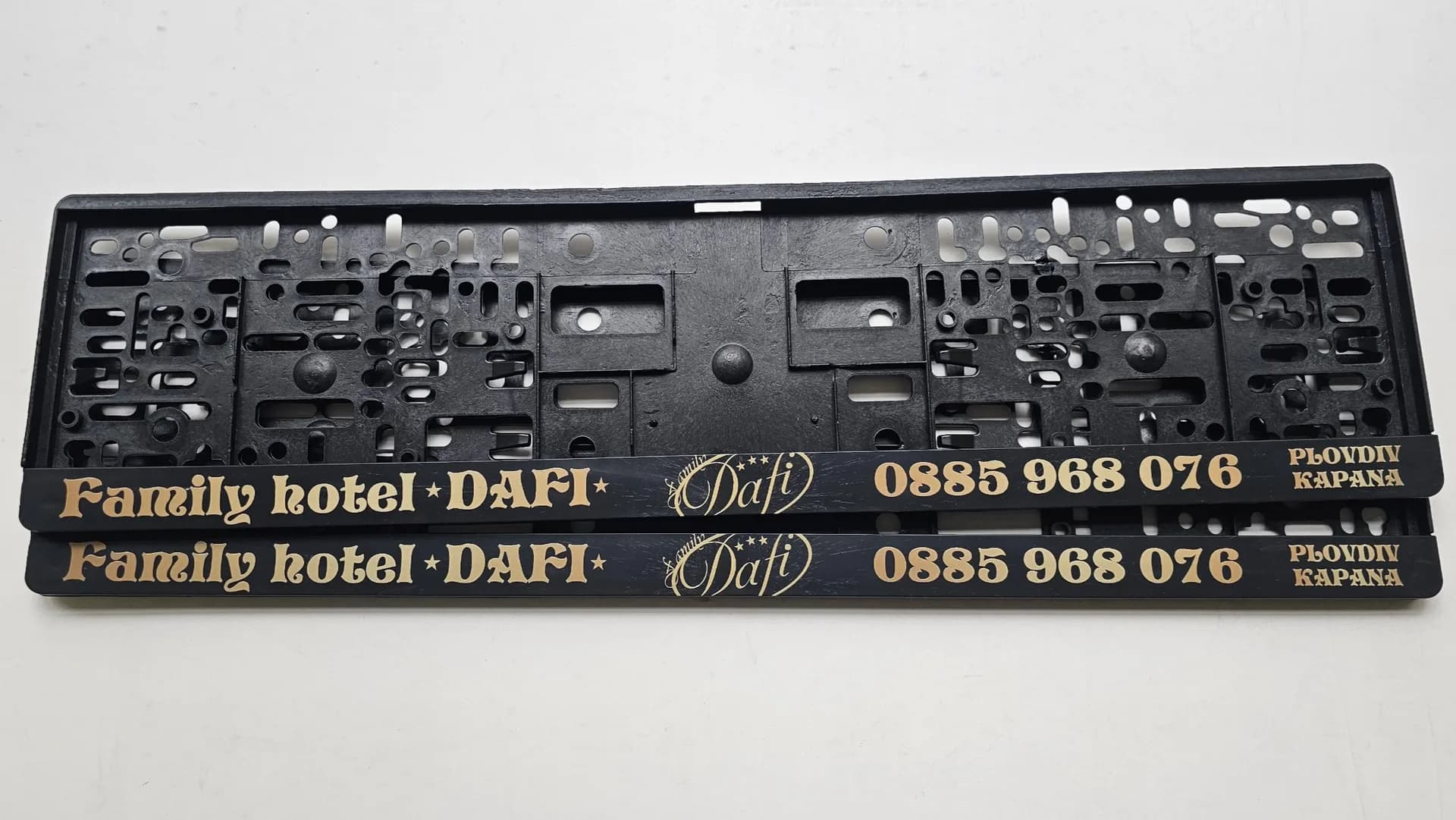 Family hotel DAFI advertising license plate frames with UV print and personalized logo — NameYourCar.store