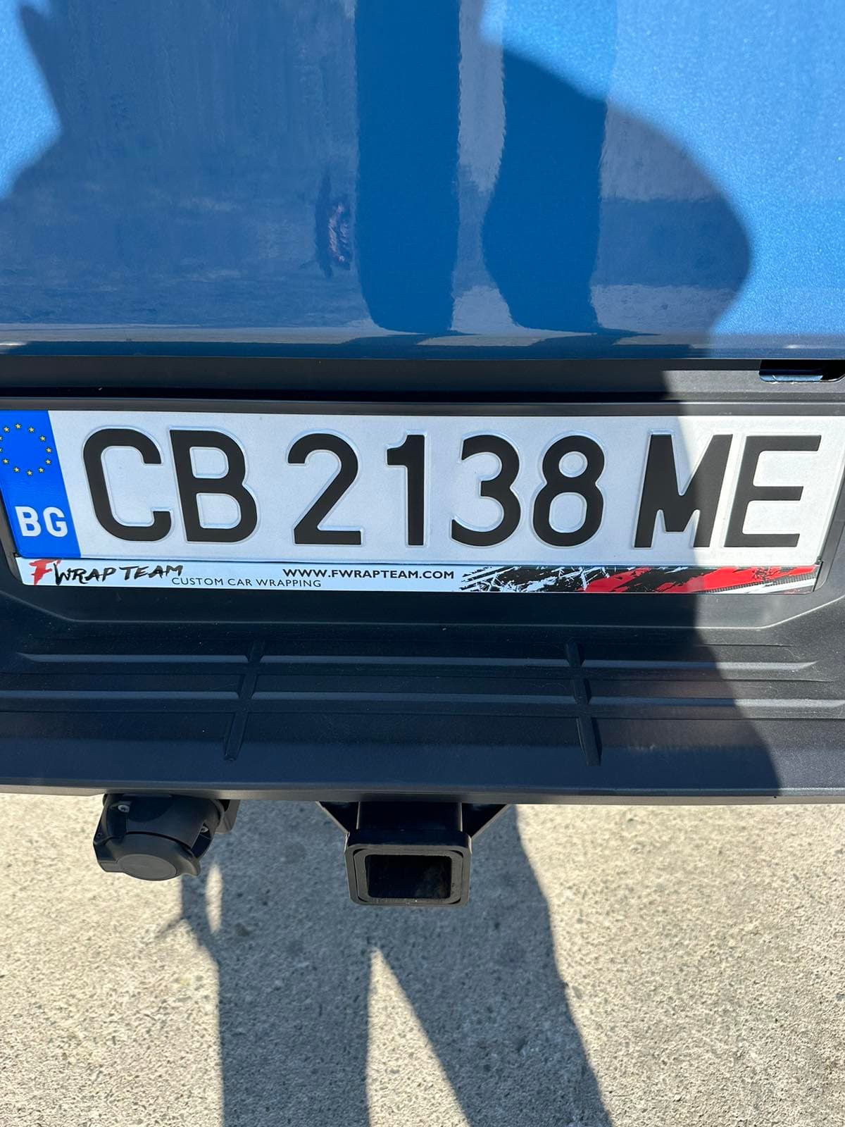 Custom license plate frame on a real customer's car from NameYourCar.store — UV print