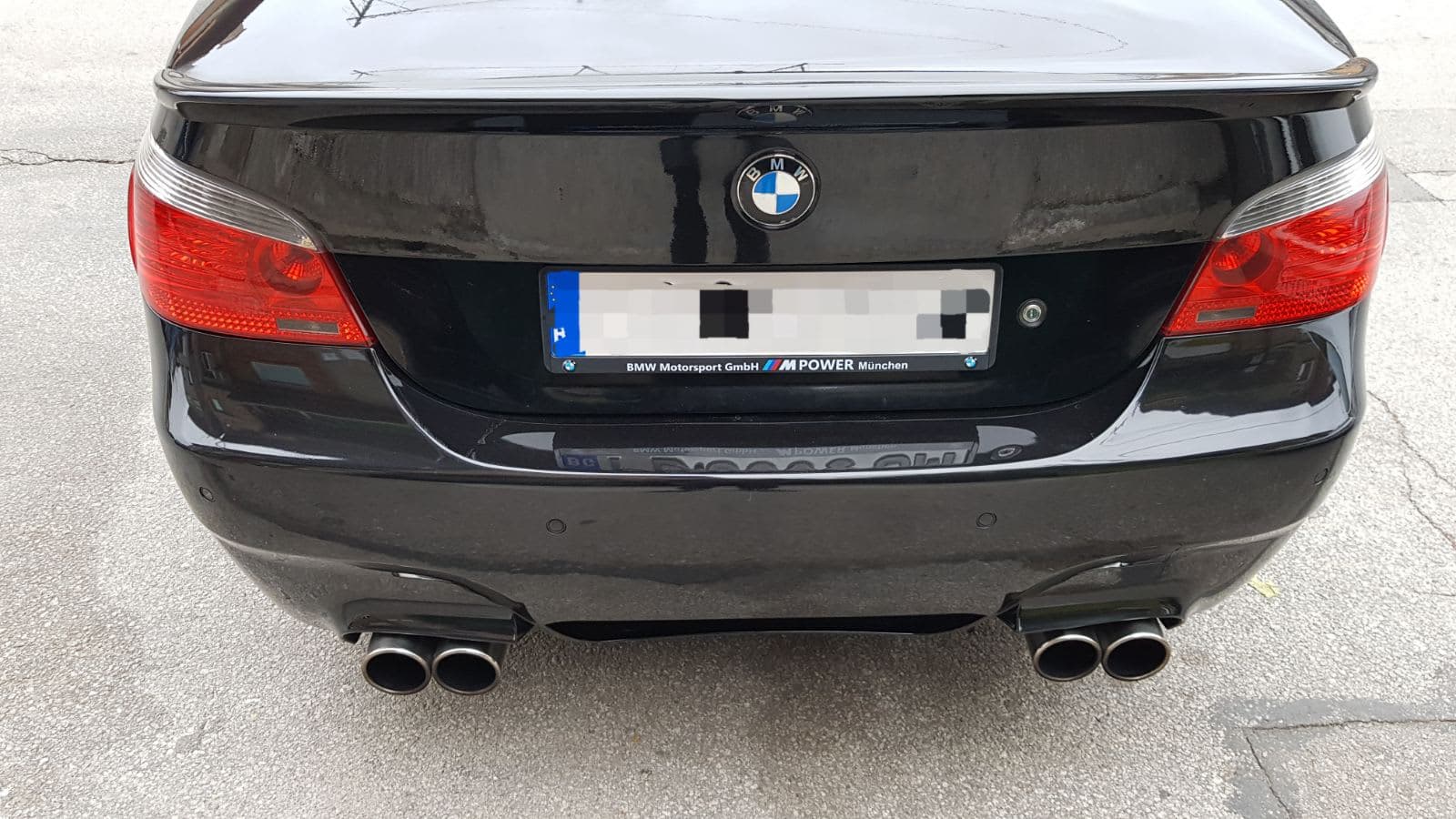 Custom license plate frame on a real customer's car from NameYourCar.store — UV print