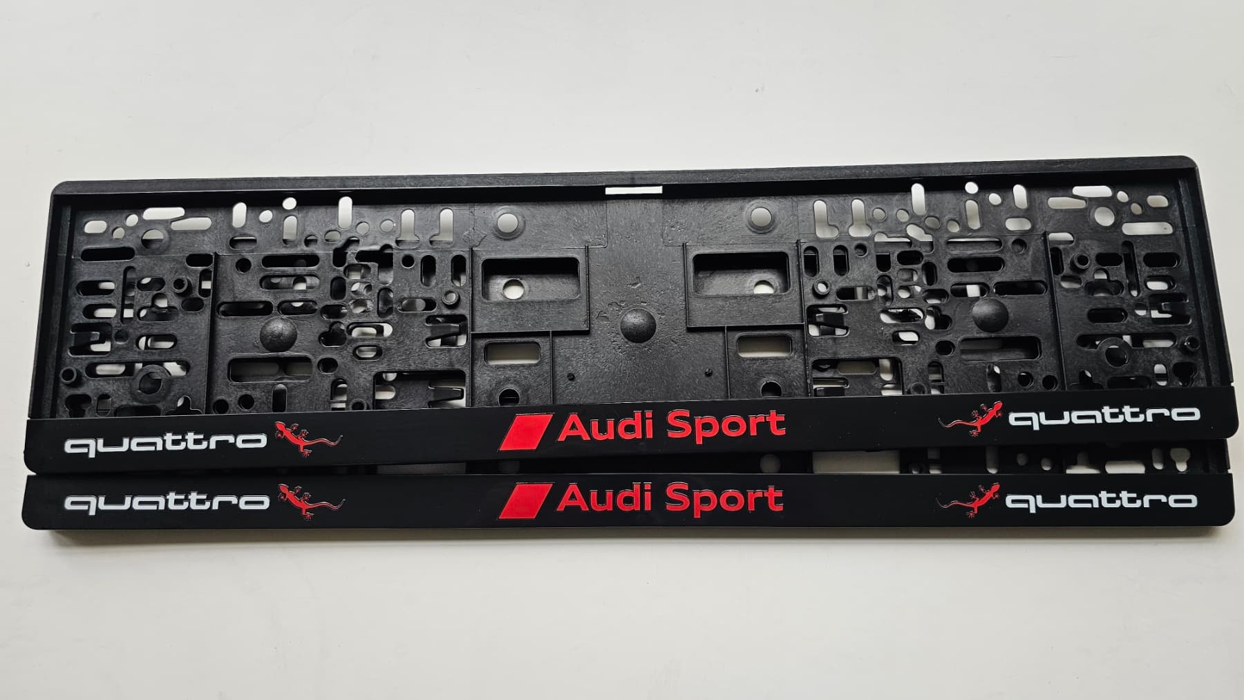 Audi license plate frame with quattro design and the geckos — UV printing