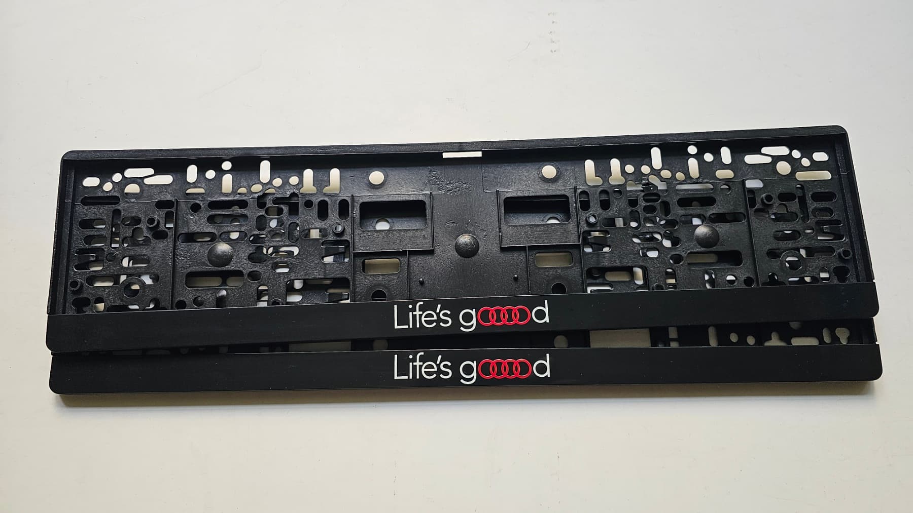 Life's Good license plate frame with the Audi four-rings logo — UV printing